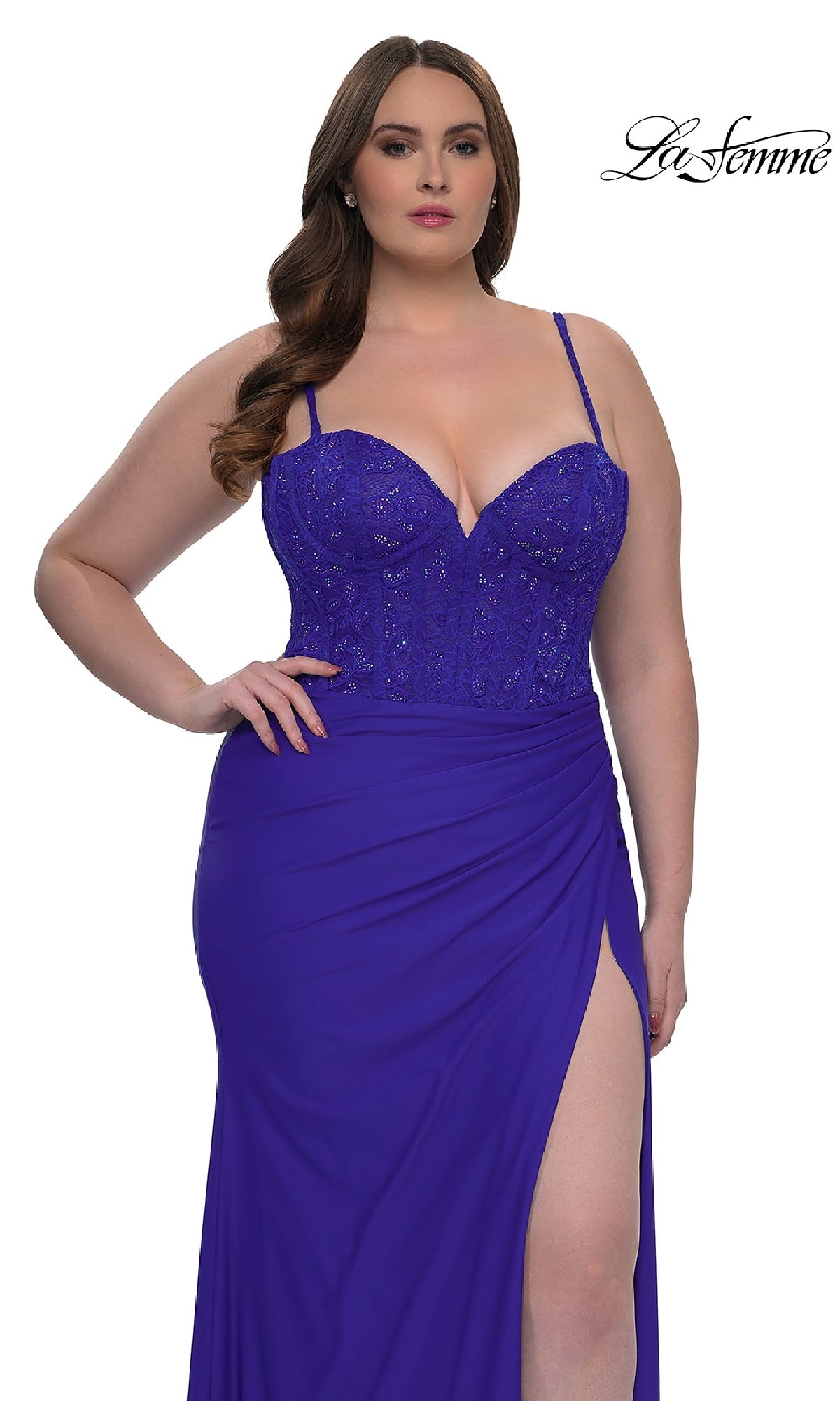 A woman wears the La Femme 32449 plus-size long corset prom dress in royal blue, featuring spaghetti straps, a lace bodice, and a thigh-high slit. The La Femme logo appears in the top right corner.